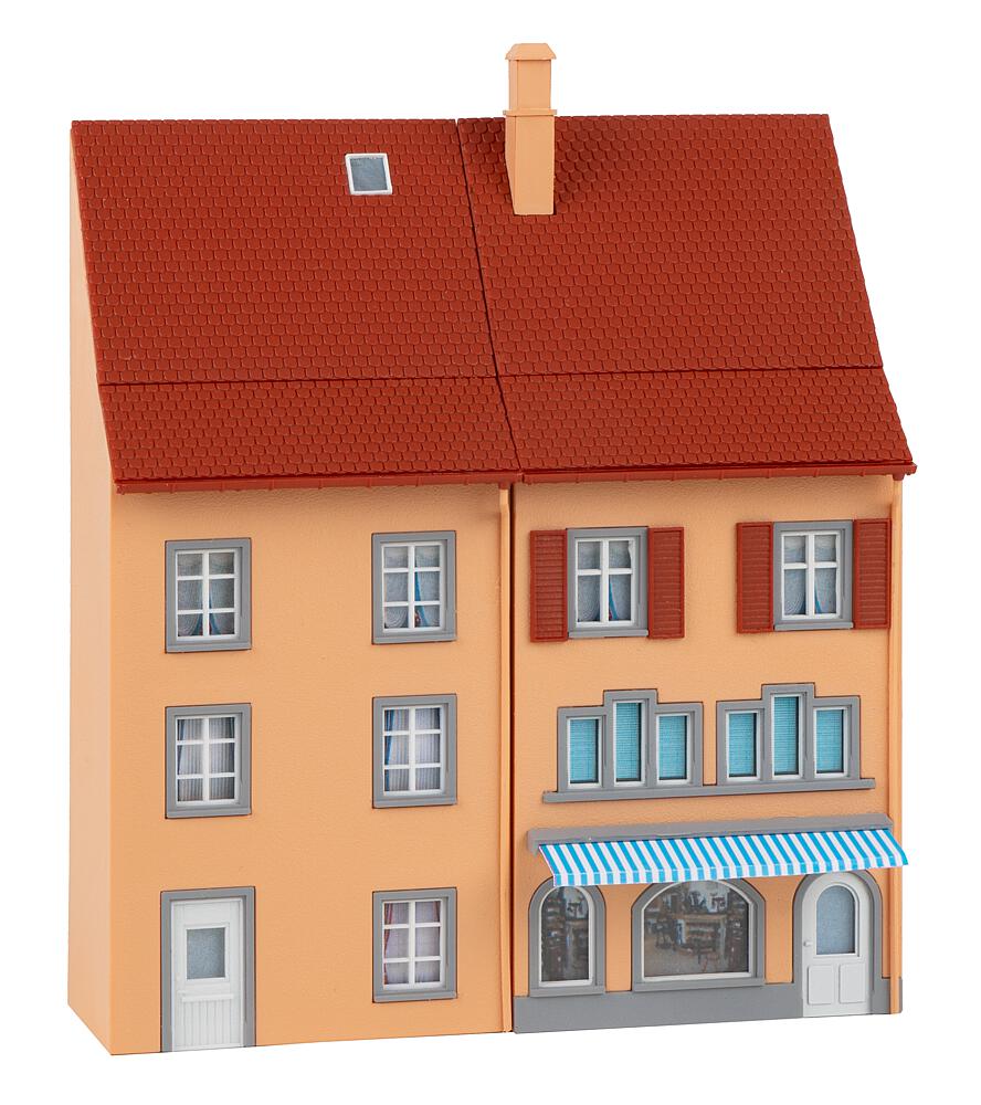 Demolition house with excavator