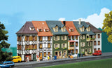 City corner house with tattoo parlour