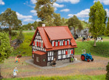 Hunting lodge with raised hide
