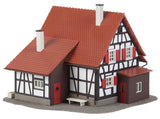 Hunting lodge with raised hide