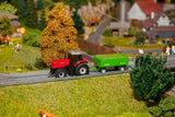 Forest workers with modern equipment