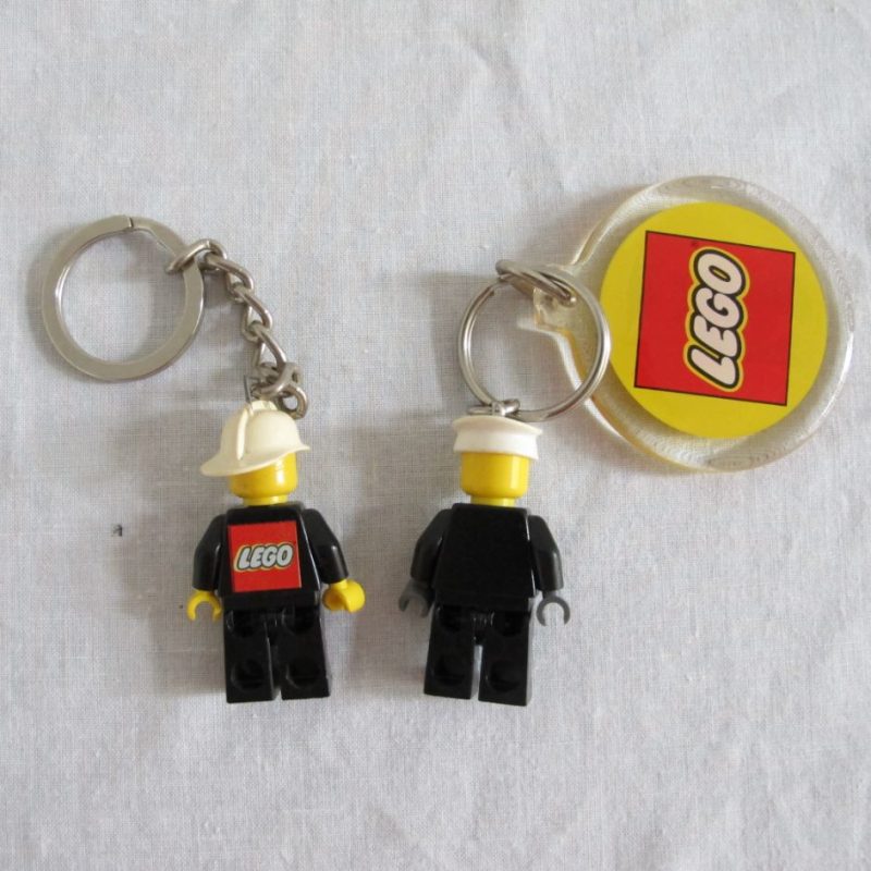Two keychain minifigures, one fireman, one policeman