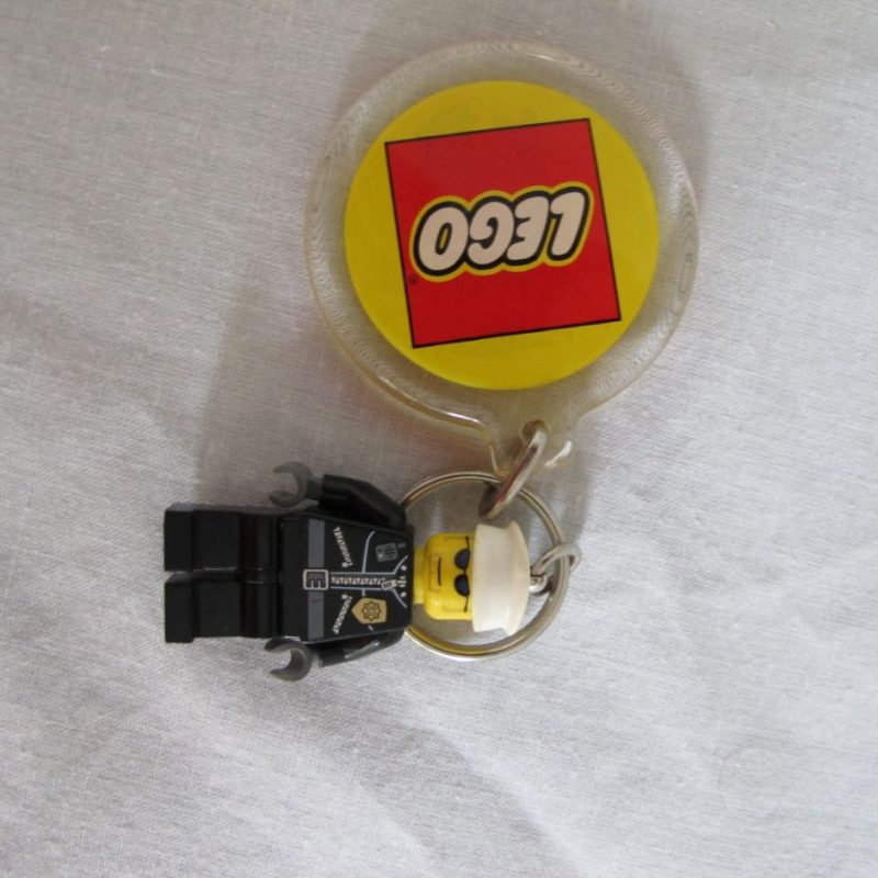 Two keychain minifigures, one fireman, one policeman