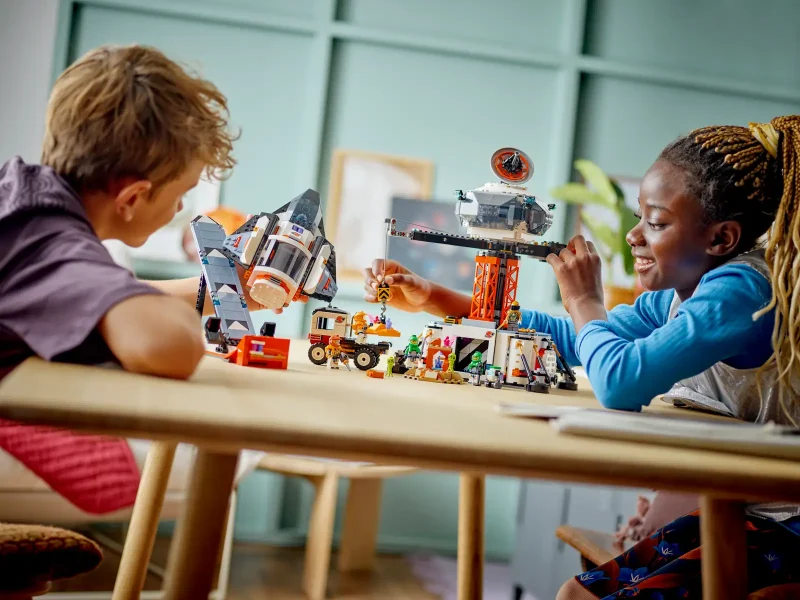 Kids playing with LEGO City 60434 - Space Base and Rocket Launchpad