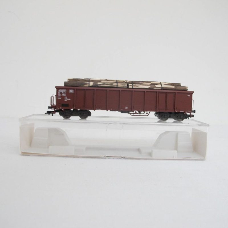 High-sided wagon + peeled logs