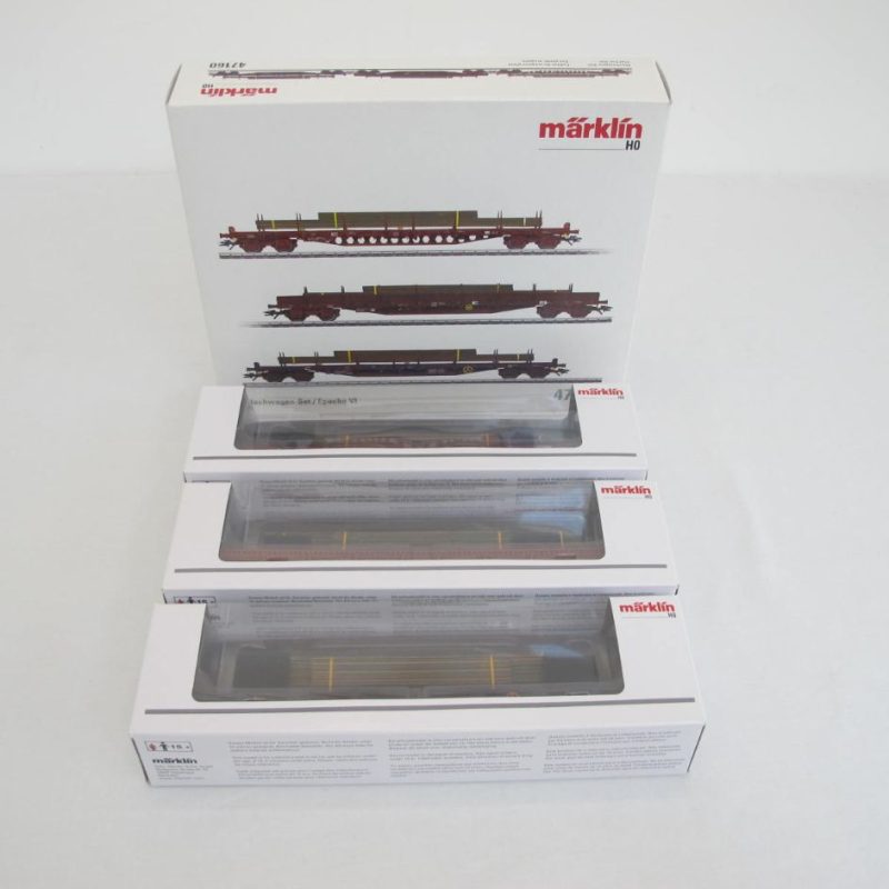 Three stake cars. All CFL Cargo SA wagons with steel plates