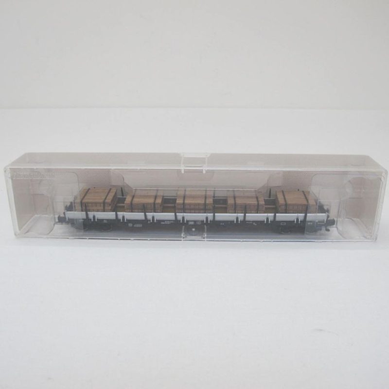 Flat wagon loaded with wooden sleepers